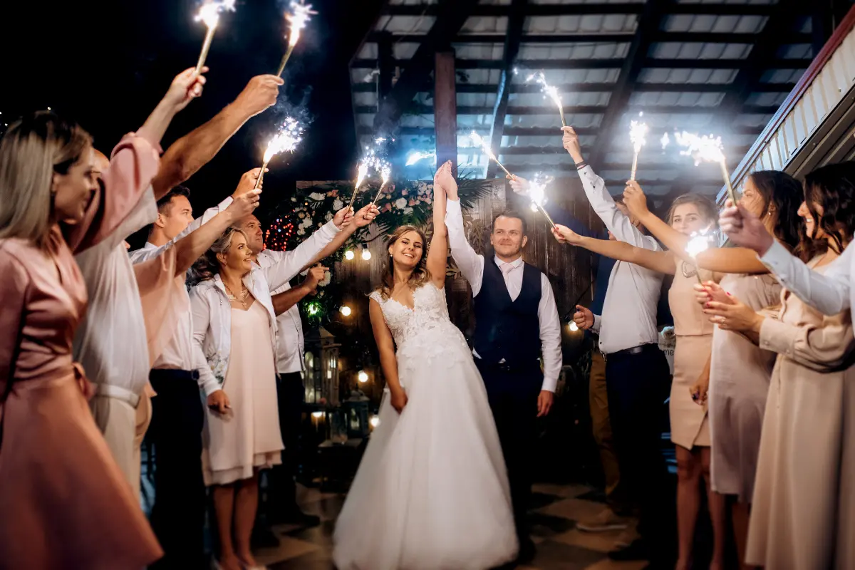 Newlyweds Celebrating With Guests At The End Of A Well-Paced Wedding Planning Timeline That Allowed The Day To Flow Naturally